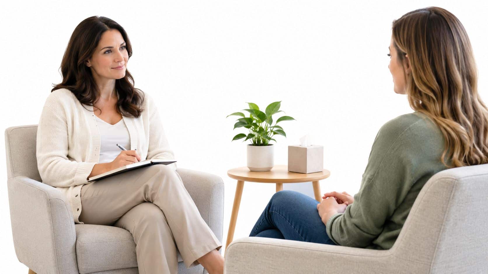A female therapist listens attentively to her client during a professional acceptance and commitment therapy session.